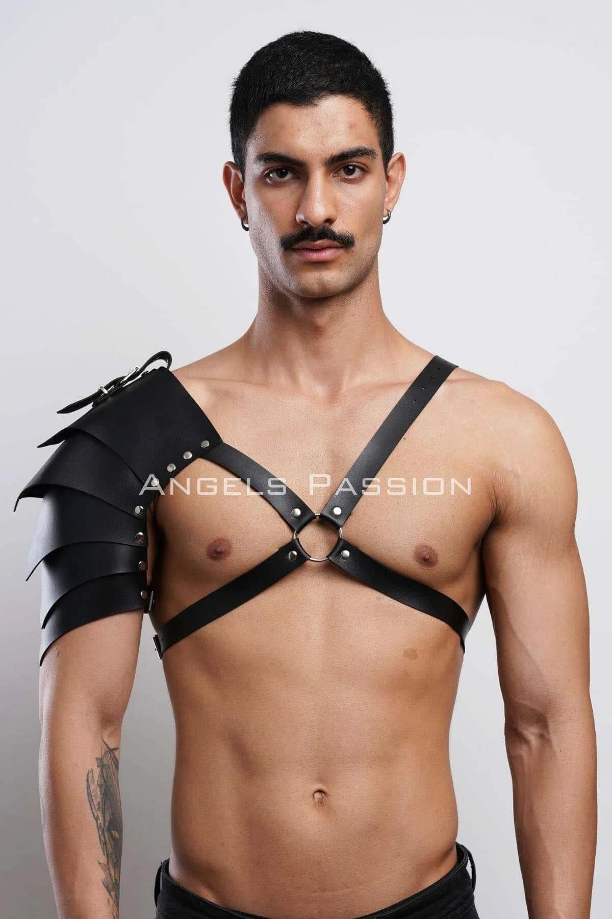 Close-up of three-panel black faux leather pauldron with silver-tone rivet details and buckle closure