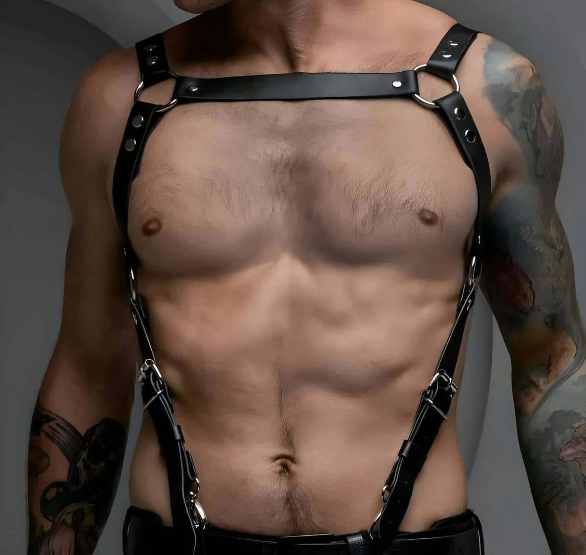 close-up of silver O-ring and rivet hardware on black faux leather chest band