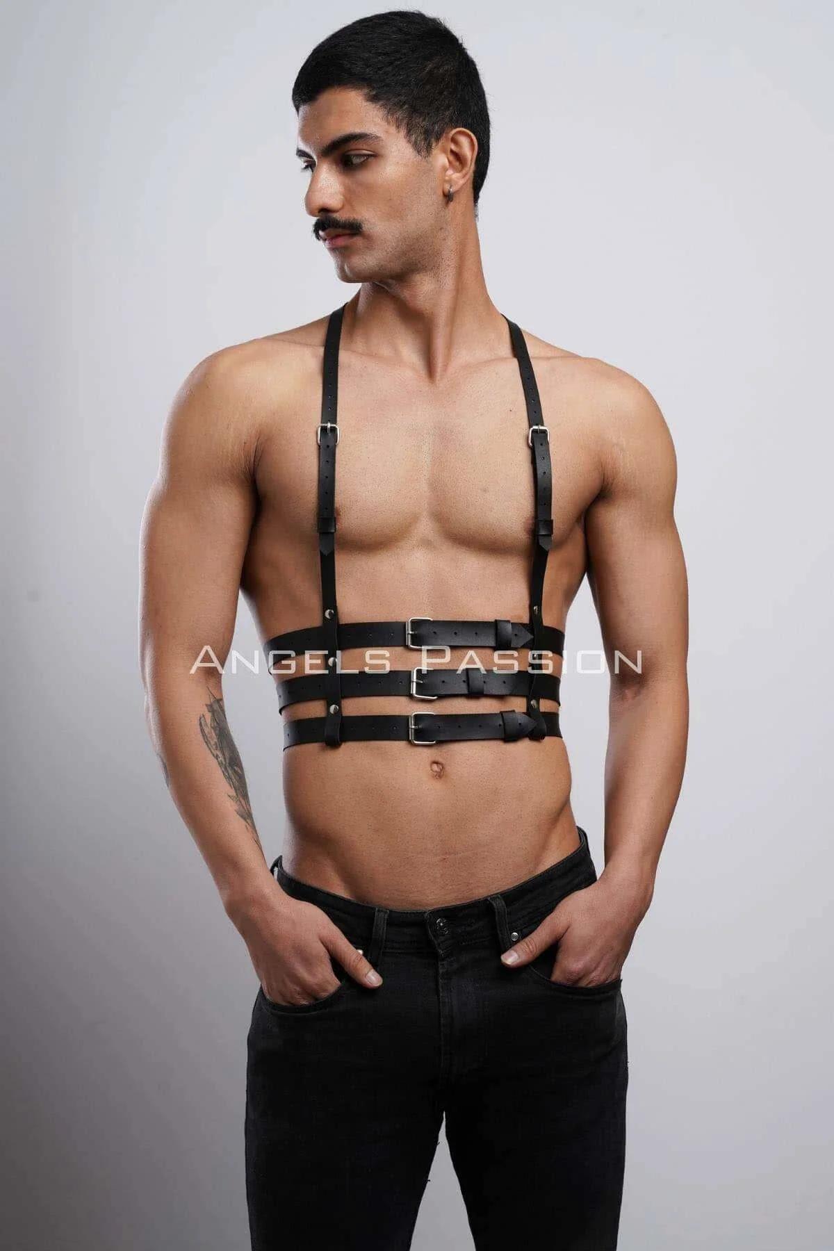 Close-up of three silver rectangular buckles on black faux leather chest harness horizontal bands