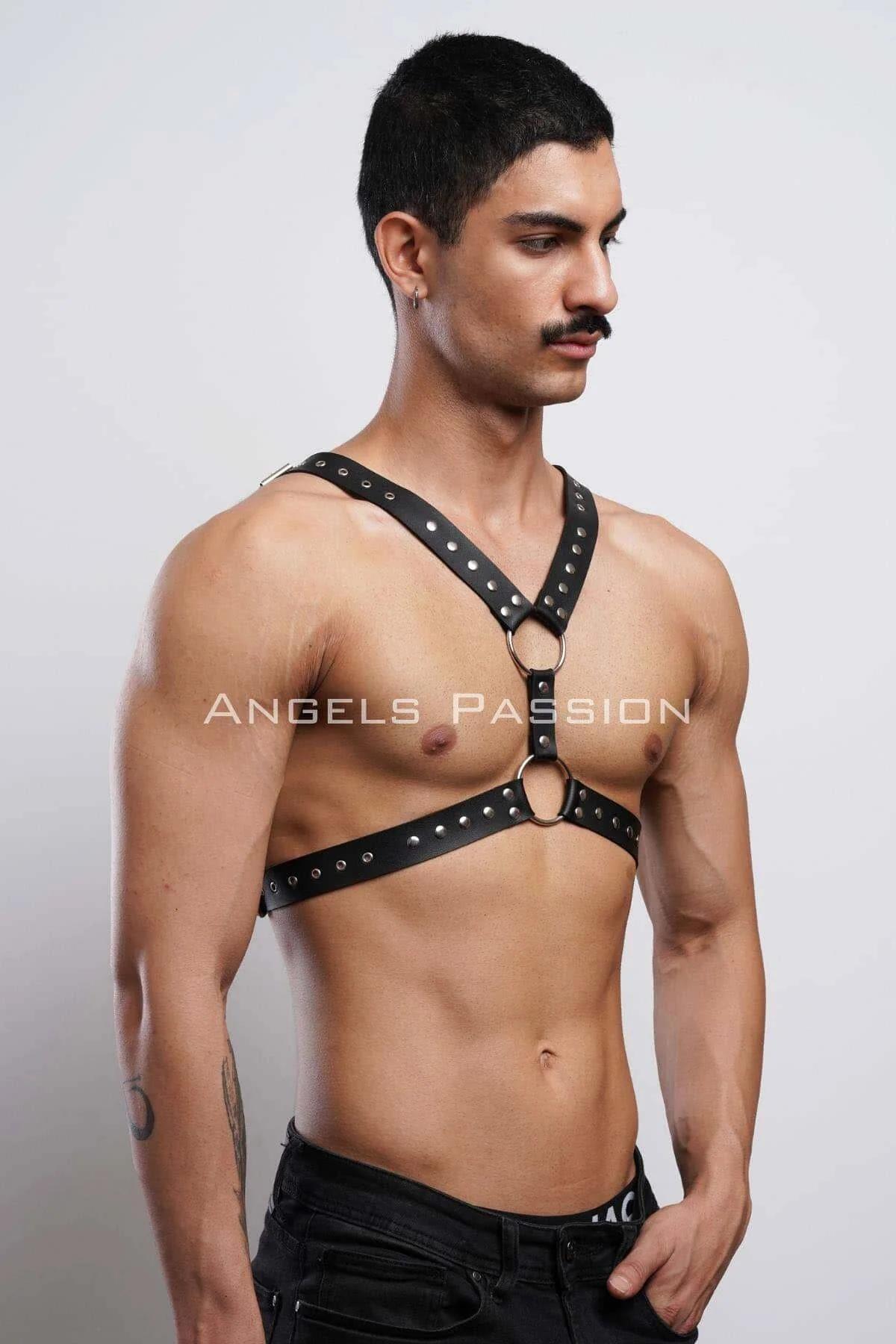 black studded harness laid flat showing dual horizontal bands and shoulder strap configuration
