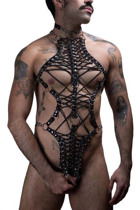 close-up of silver O-ring intersections on black faux leather crisscross harness chest panel