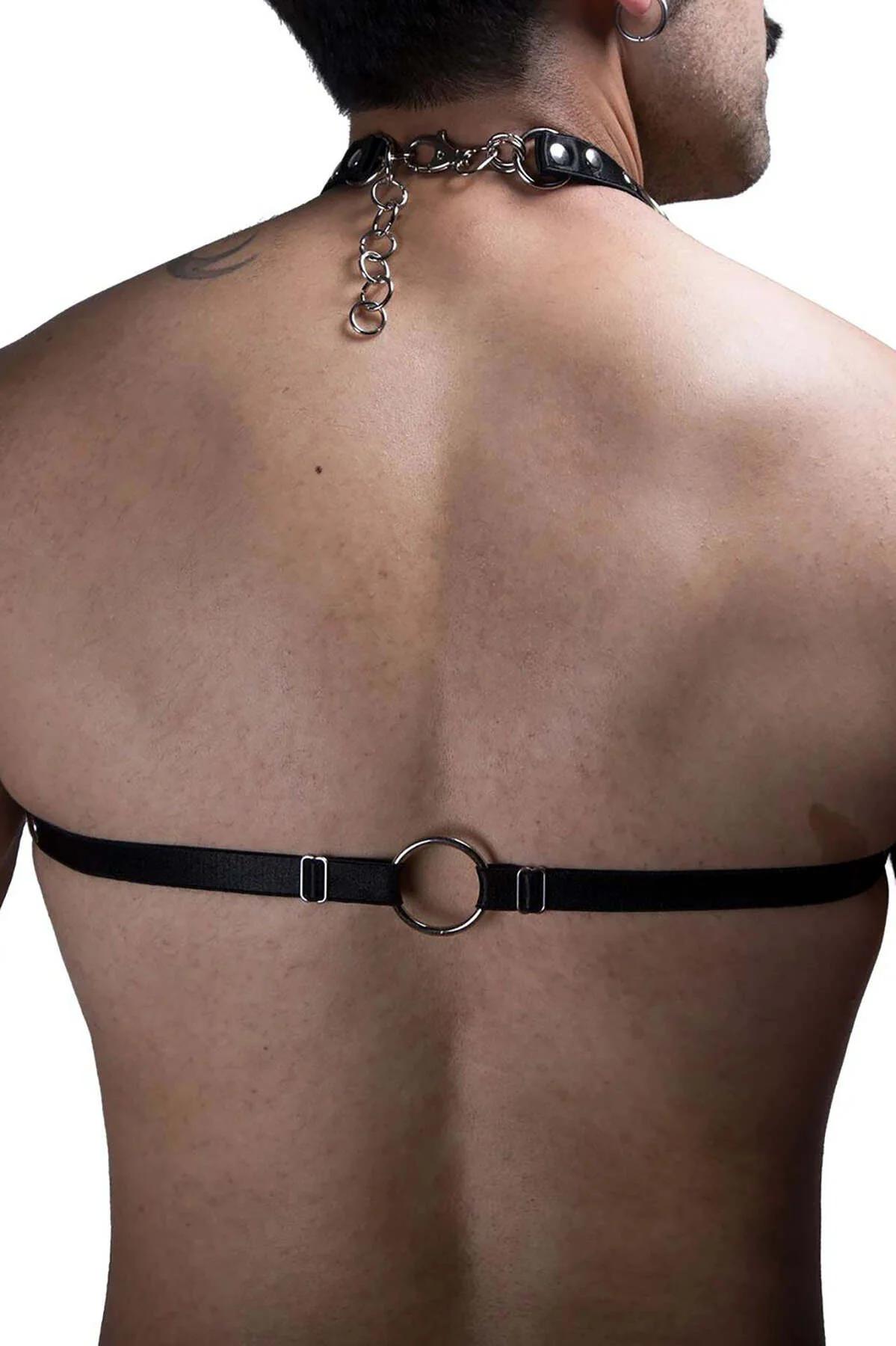 Black men's chest harness with silver chain detail laid flat showing full strap configuration