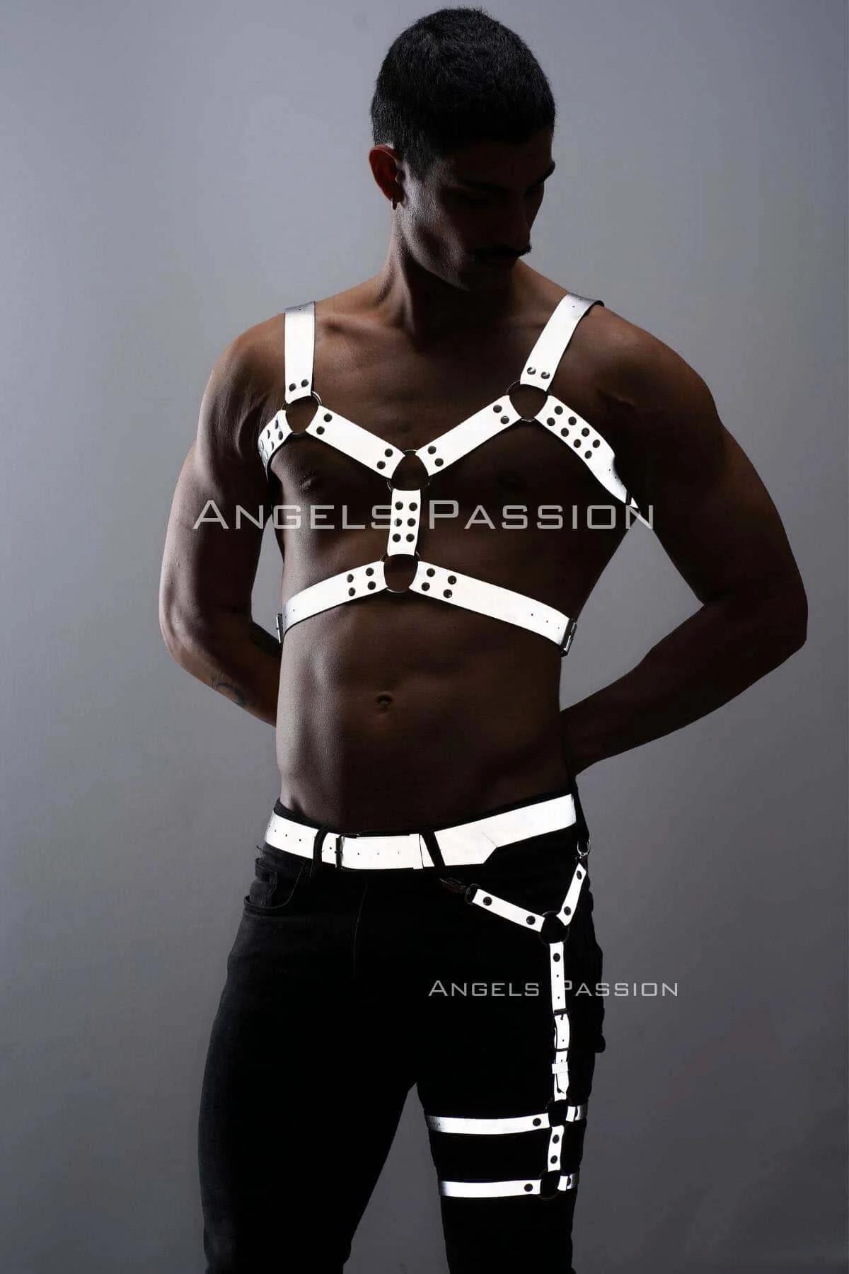 Close-up of white faux leather chest harness X-cross strap configuration with black stud detailing