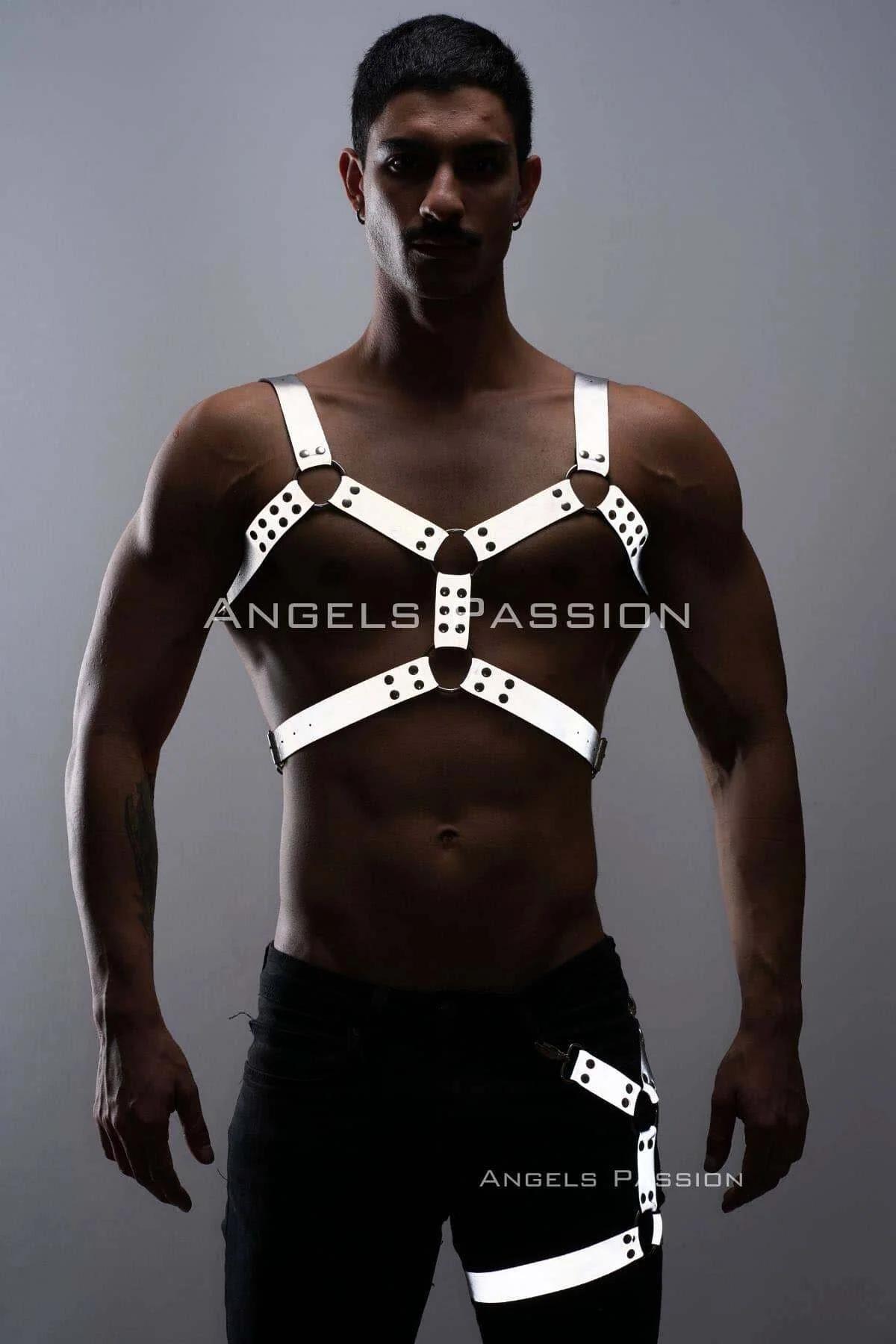 White leg harness Y-strap with black O-ring on upper thigh over black jeans