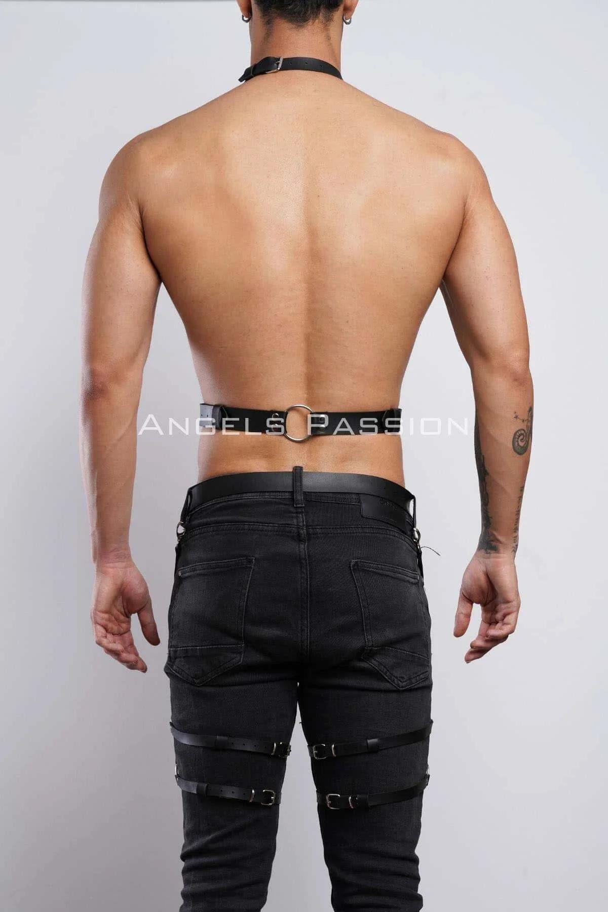 Full length view of two-piece black harness set styled over bare torso and dark slim jeans