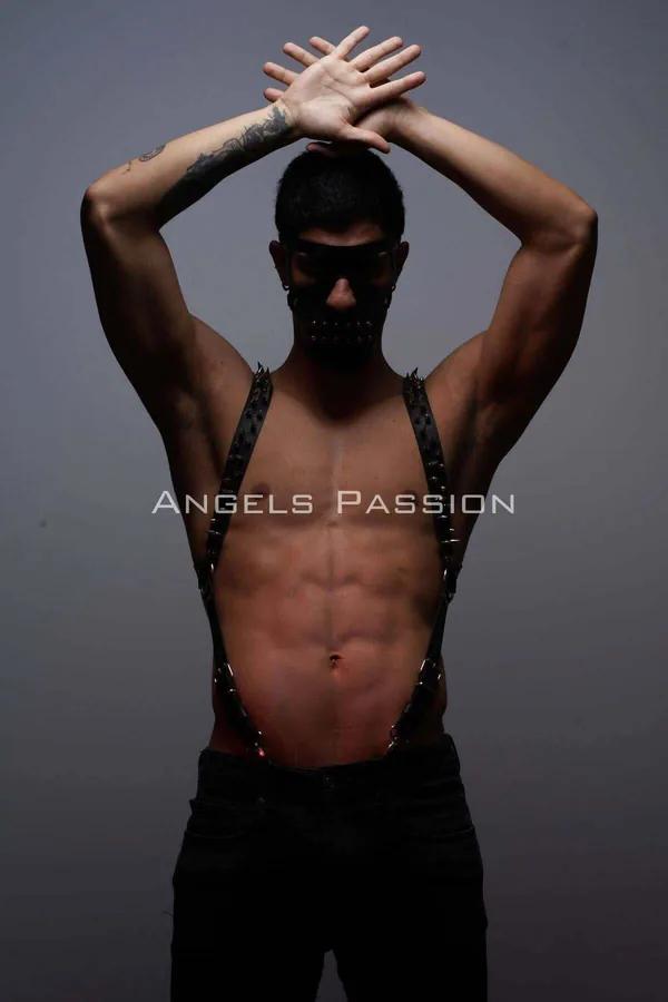 black studded faux leather suspenders harness with silver pyramid spike studs and O-ring waist clips worn on male torso