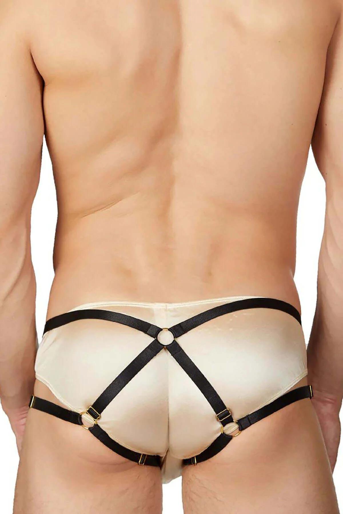 gold O-ring hardware detail on black faux leather strap junction of cream satin brief