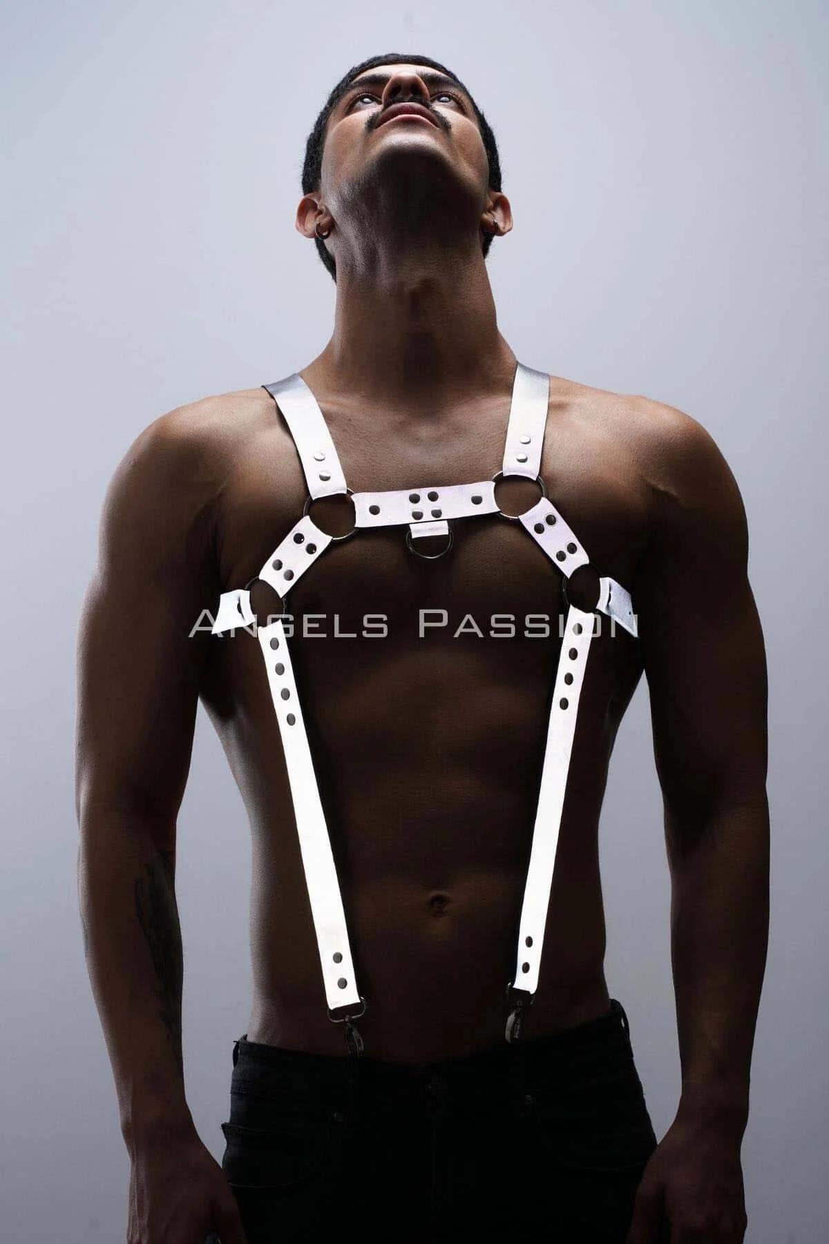 Side view of reflective white trouser harness straps with swivel clip ends on black trousers