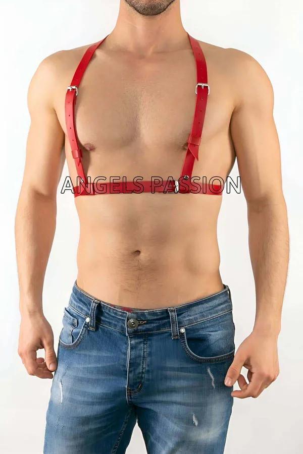 Red faux leather adjustable chest harness with silver buckles worn by male model over bare chest
