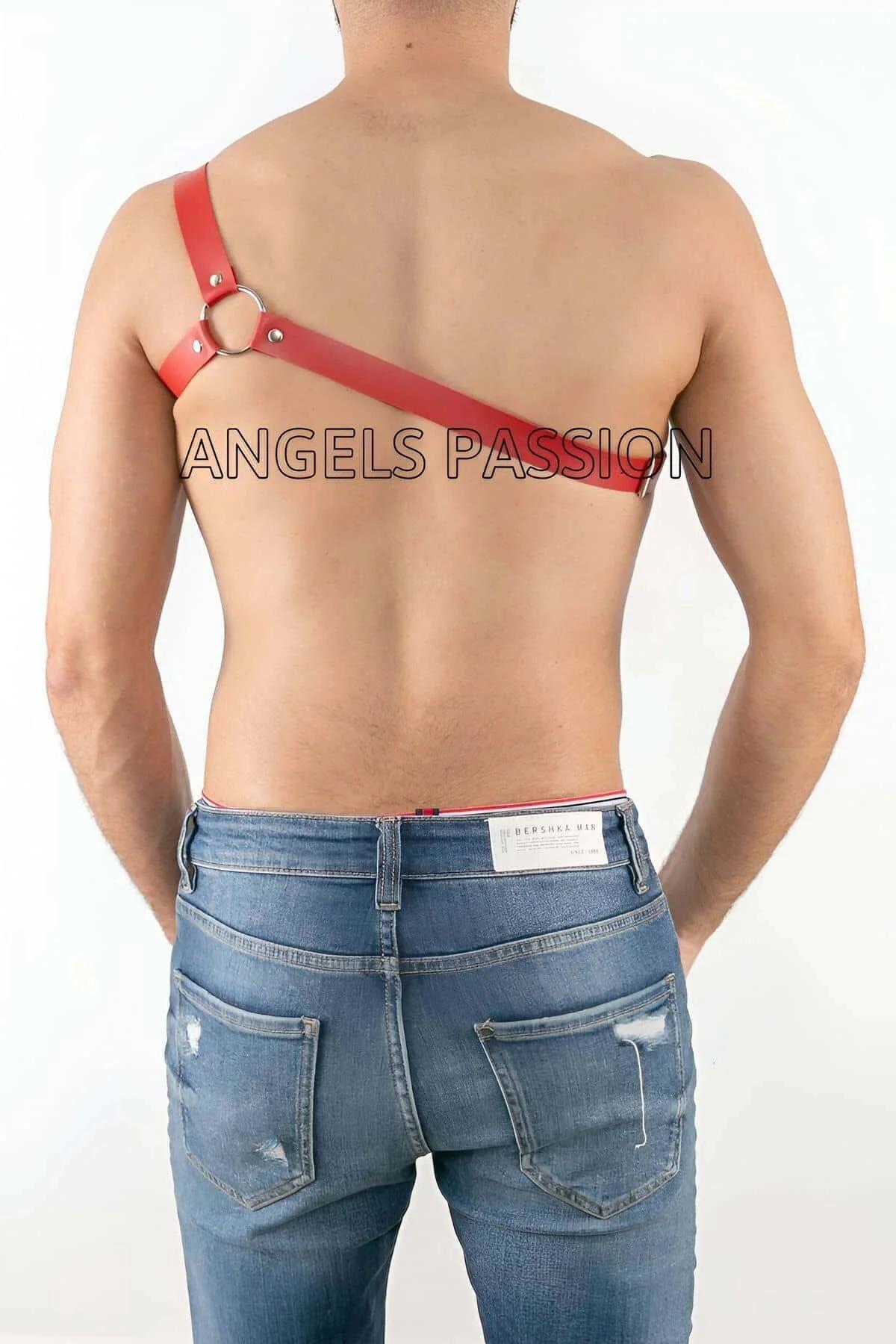 Red one shoulder harness diagonal strap and snap-buckle adjuster hardware detail