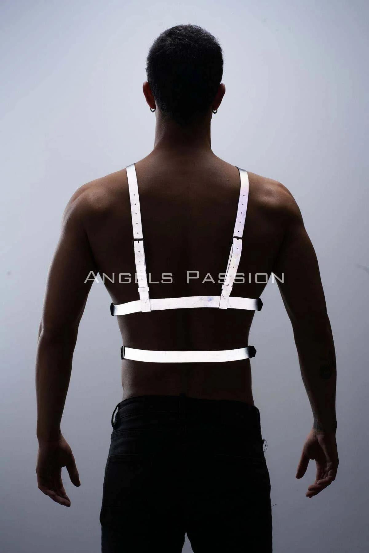 Close-up of silver single-prong pin buckle on white reflective PU leather chest harness strap