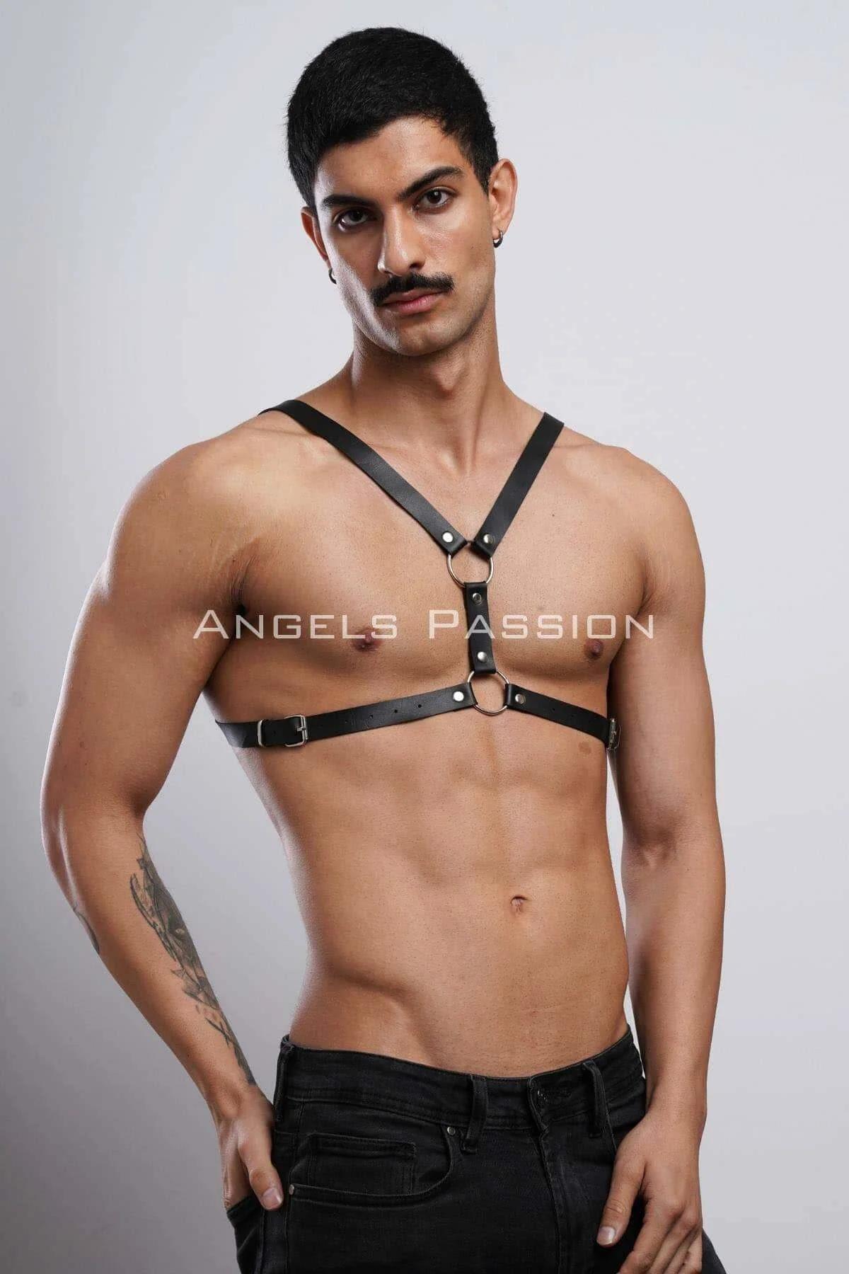 Black faux leather chest harness worn over bare skin showing dual O-ring placement