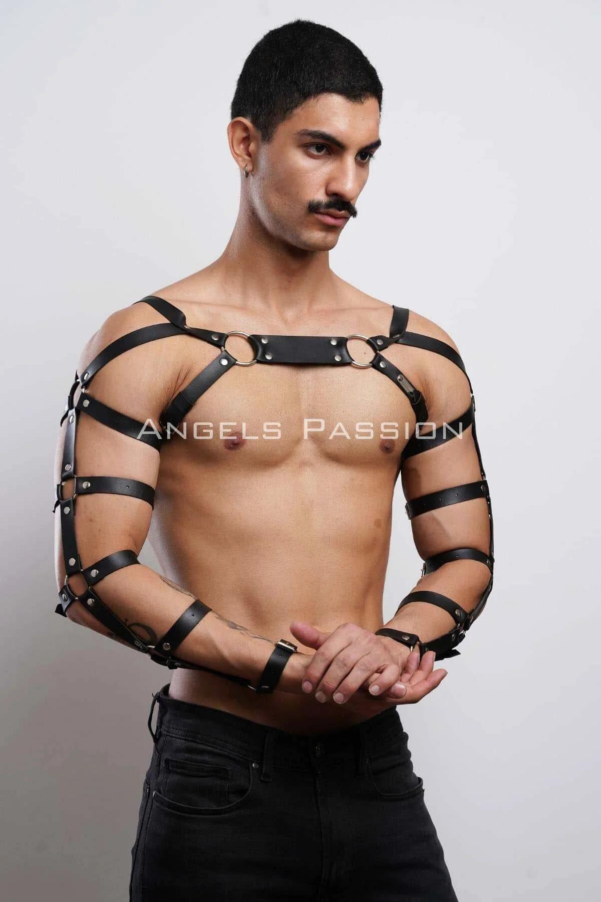 Black faux leather full arm harness styled over bare chest with black jeans for festival look