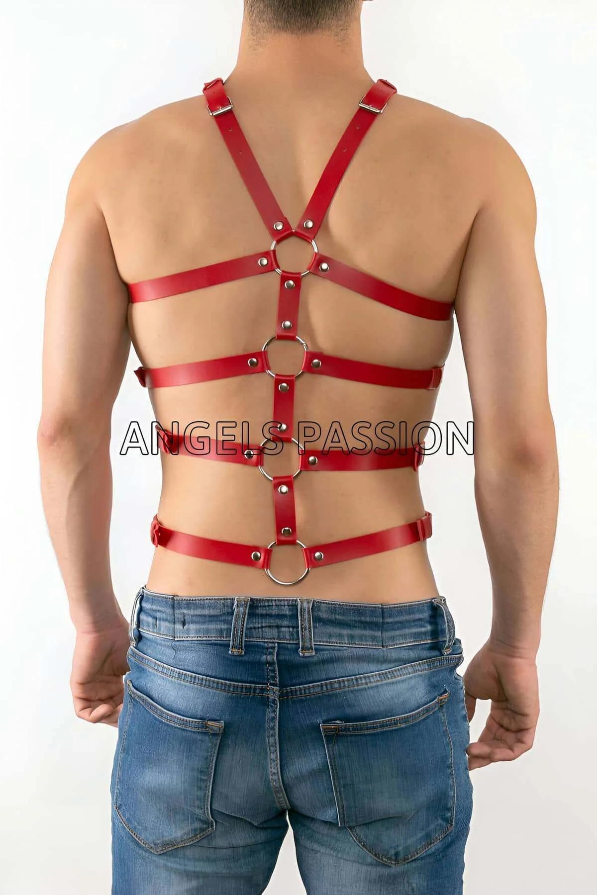 Close-up of silver O-ring and roller buckle detail on red PU faux leather strap