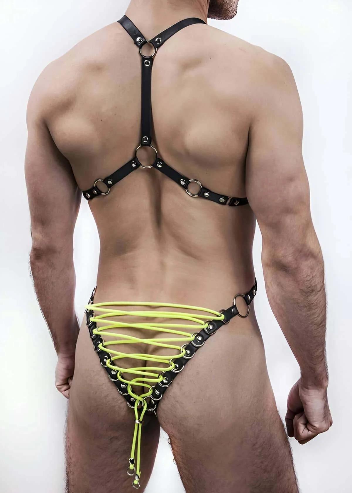 front view of black PU leather mens harness with neon yellow web lacing and seven silver O-rings