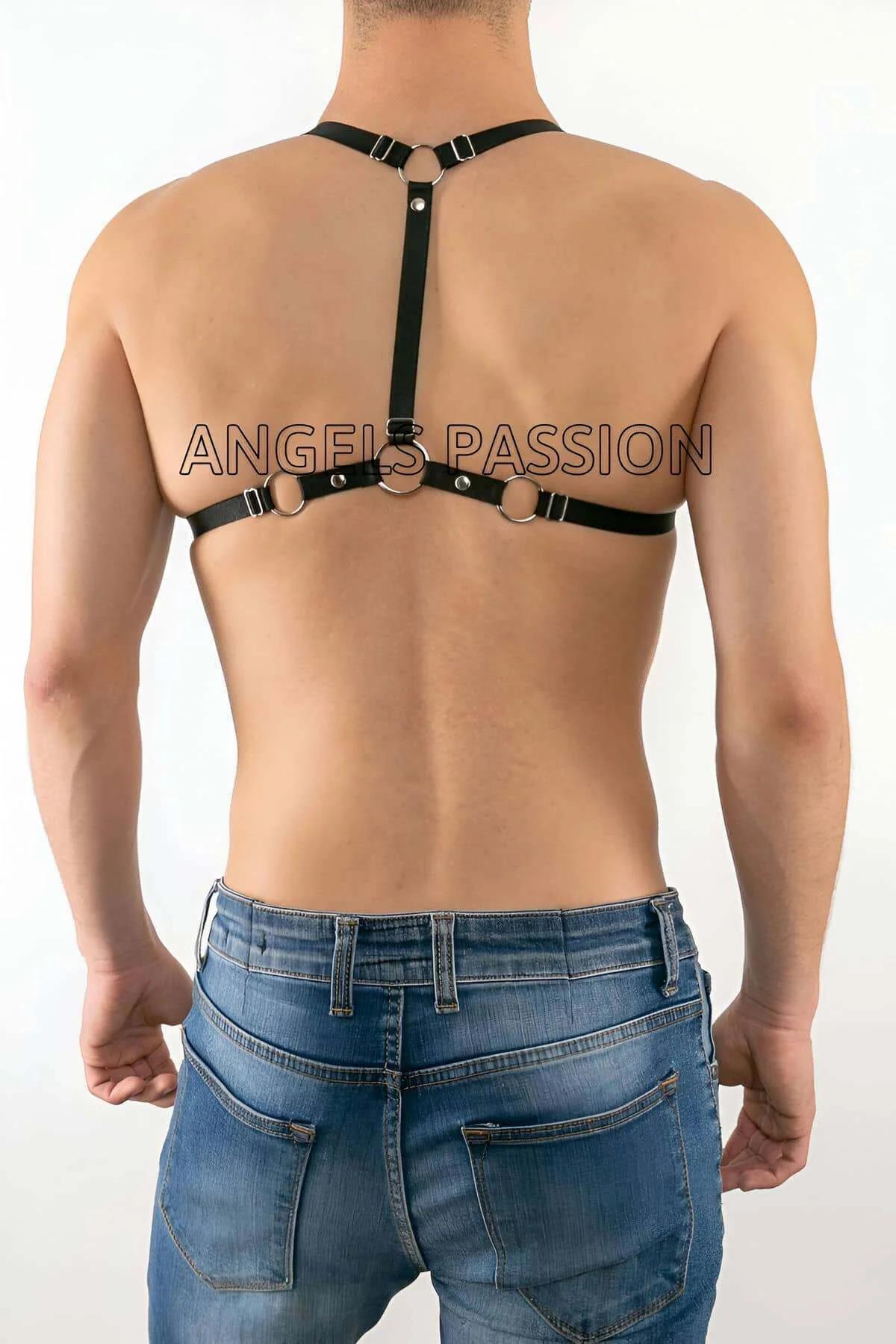 Close-up of laced front panel and dangling cord tail on black cage body harness