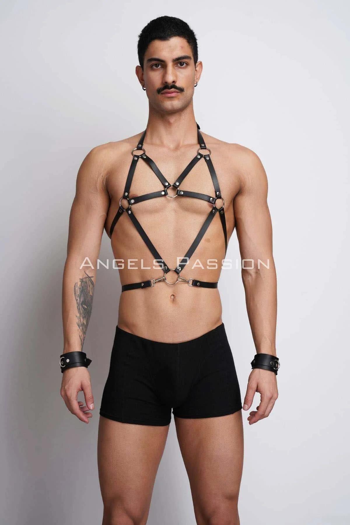 black faux leather body harness with silver O-rings and matching wrist cuffs worn by male model