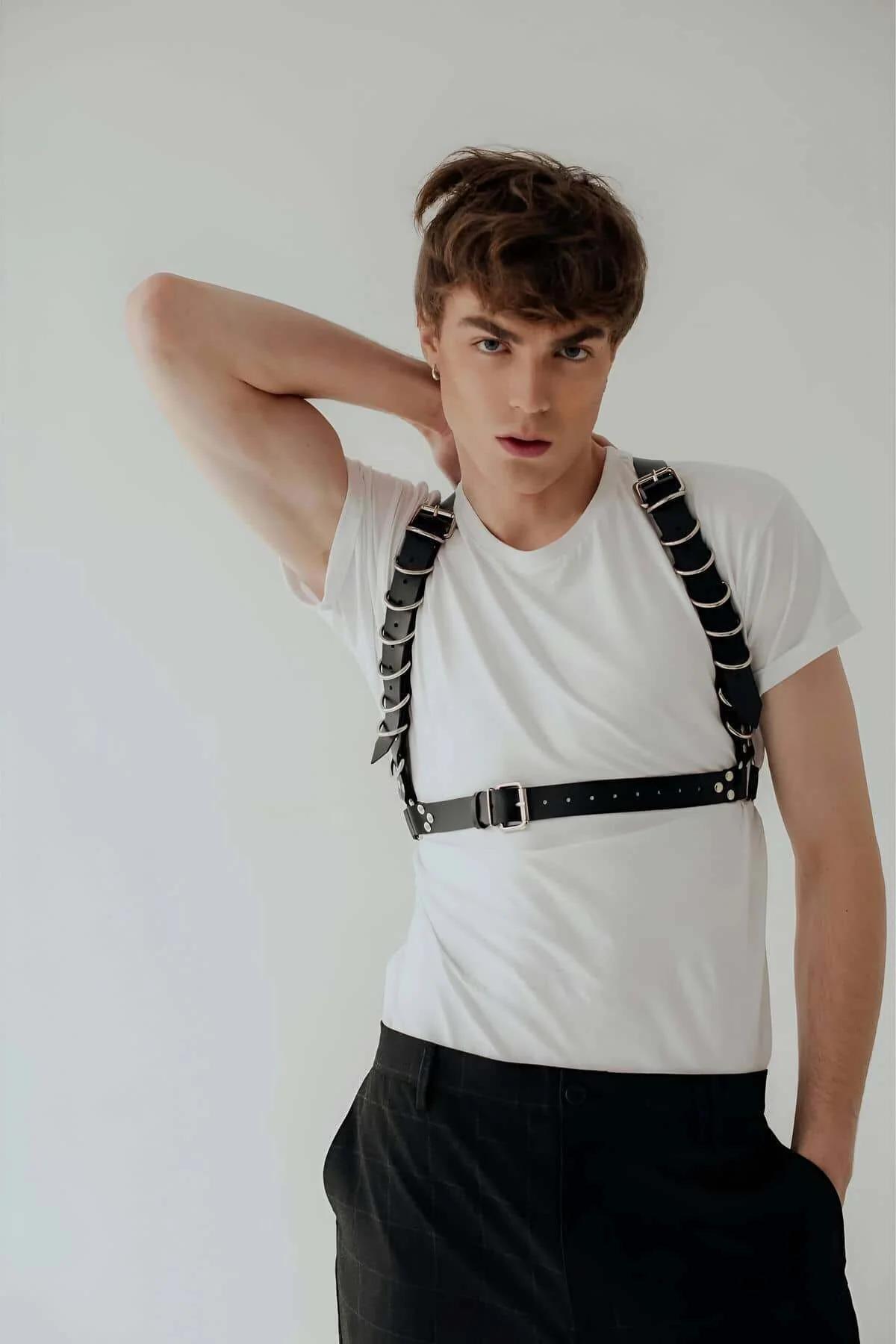Front view of silver rectangular buckle closure on black PU leather waist band with pre-punched adjustment holes