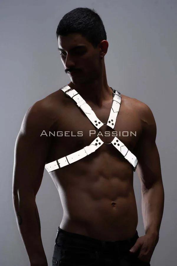 White reflective chest harness with silver O-ring detail on male torso, X-strap faux leather design
