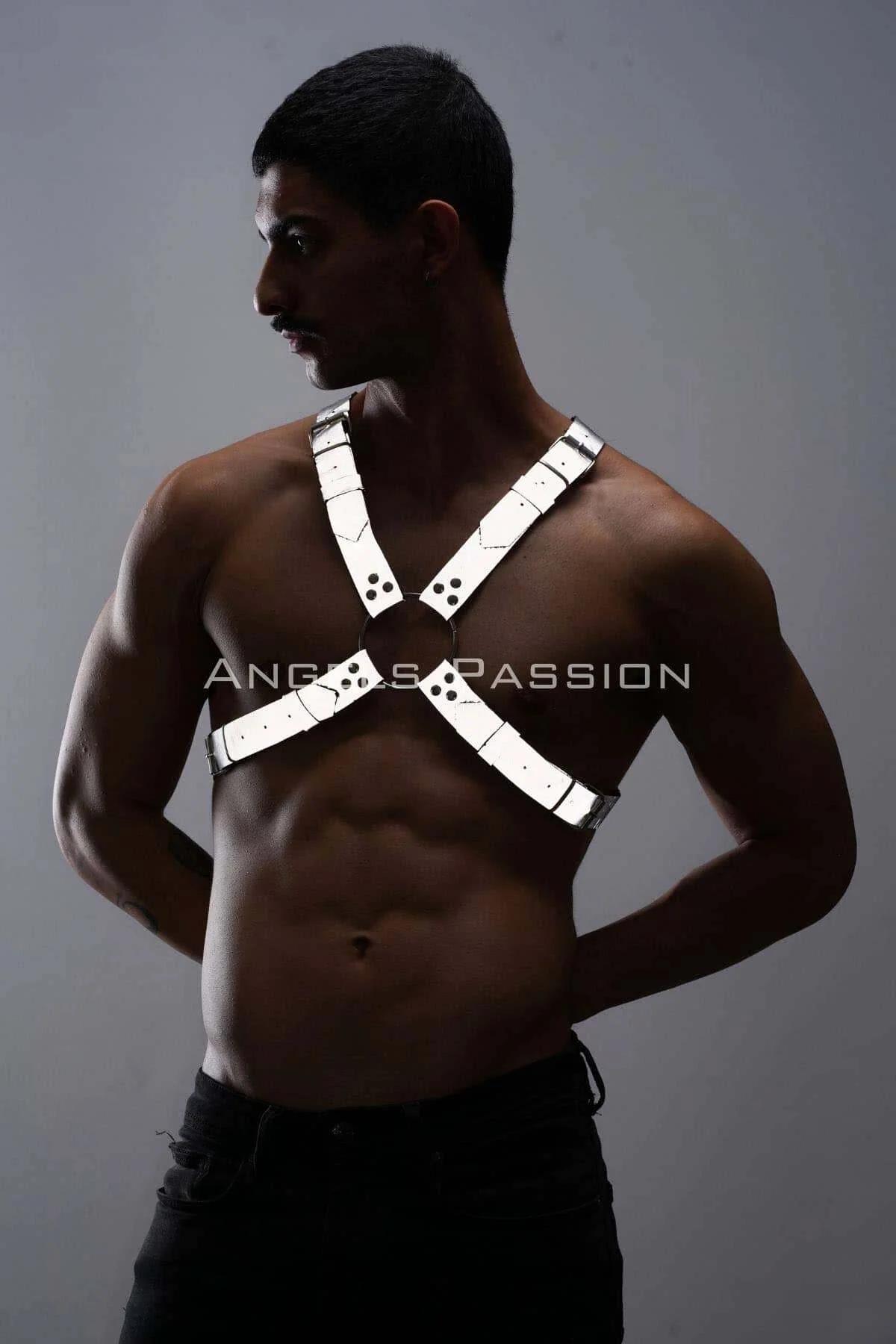 Close-up of silver O-ring center detail on white reflective faux leather chest harness