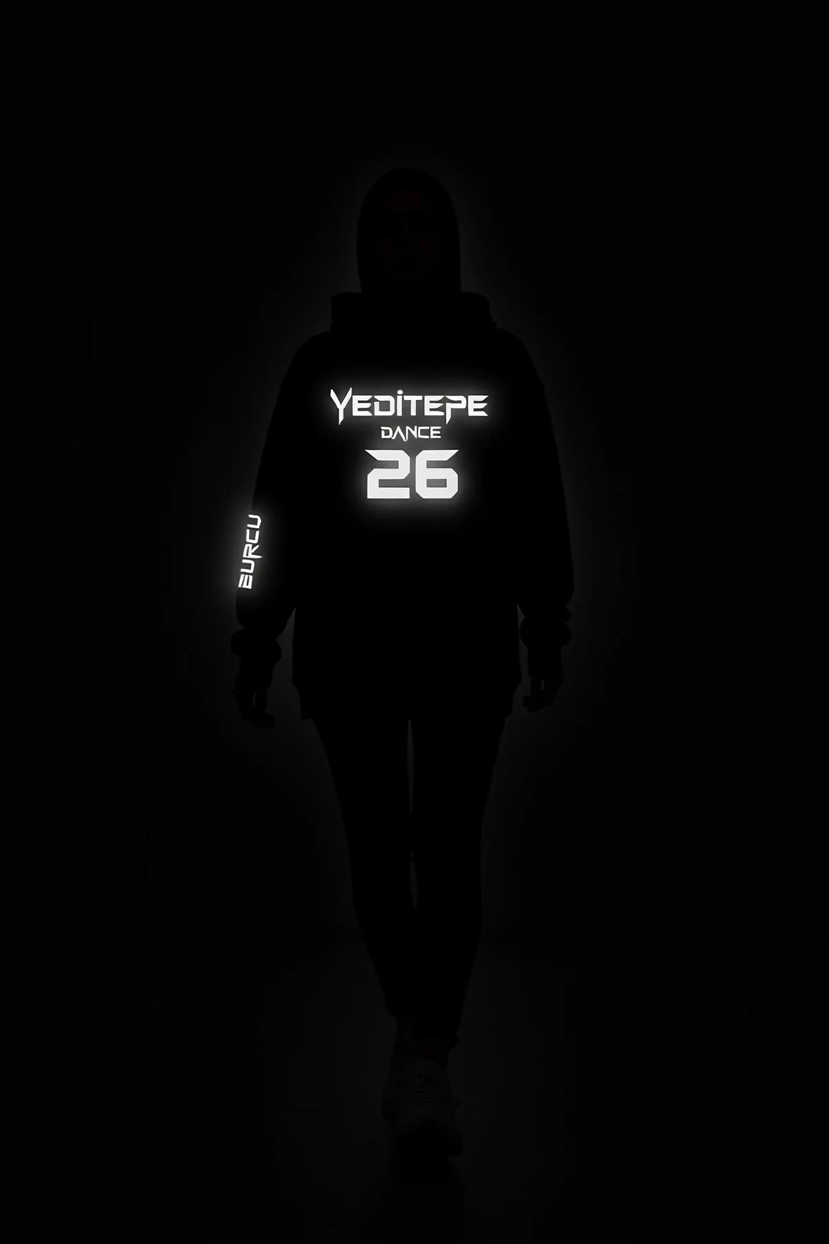 black custom reflective long sleeve top back view with white retroreflective team name number and sleeve name print glowing i