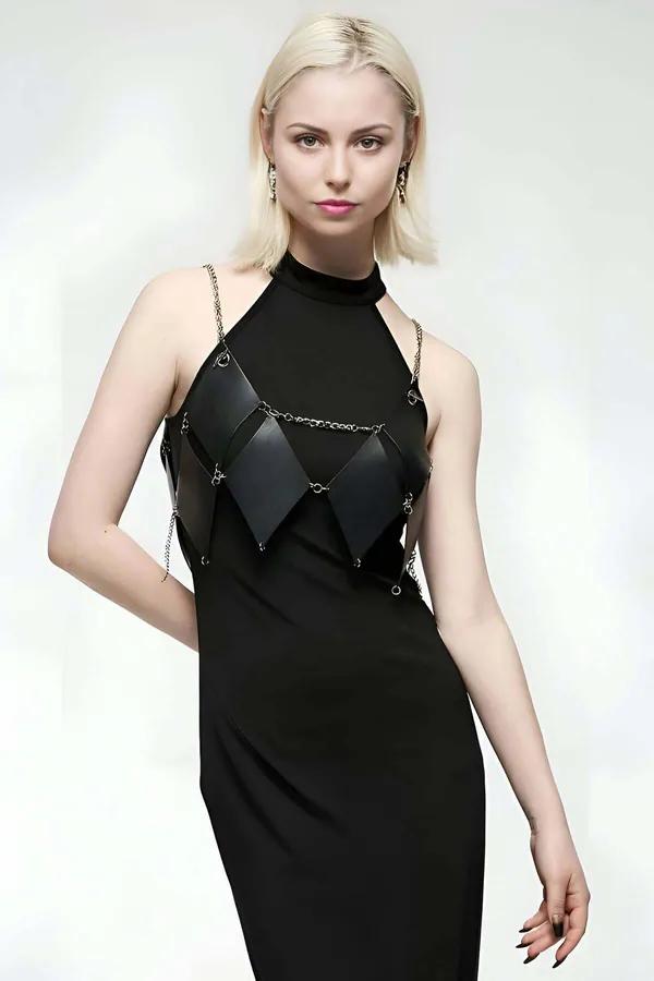Black diamond quilted faux leather body harness with silver chain straps worn over black halter dress
