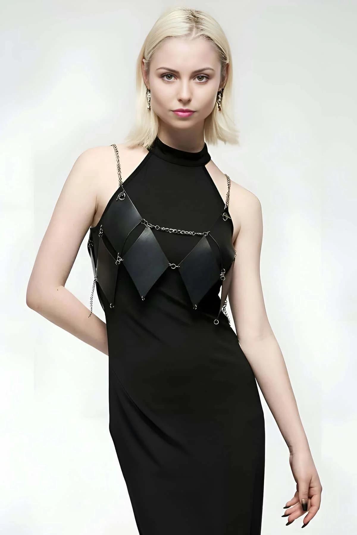 Black diamond quilted faux leather body harness with silver chain straps worn over black halter dress
