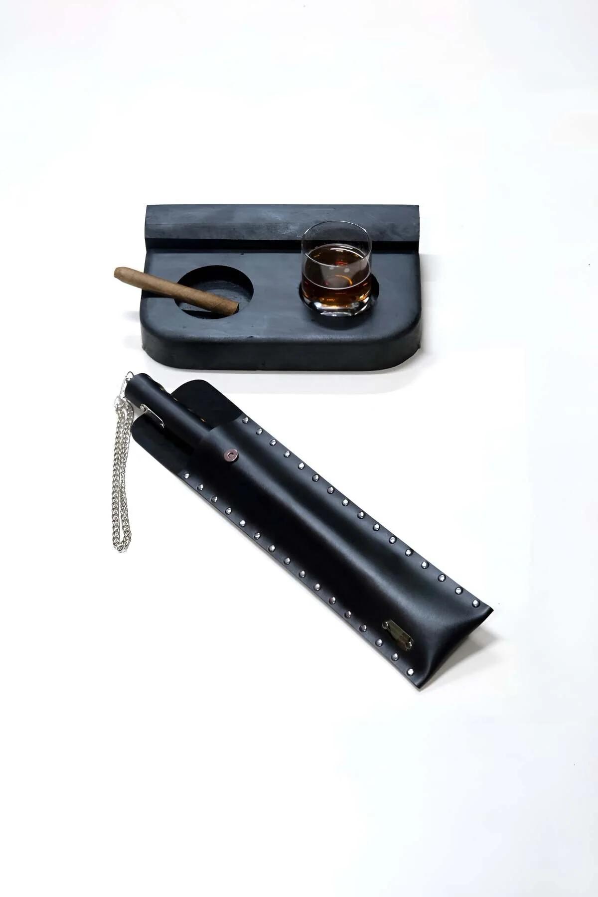 black faux leather studded paddle with silver chain and matte black whiskey tray with cigar rest