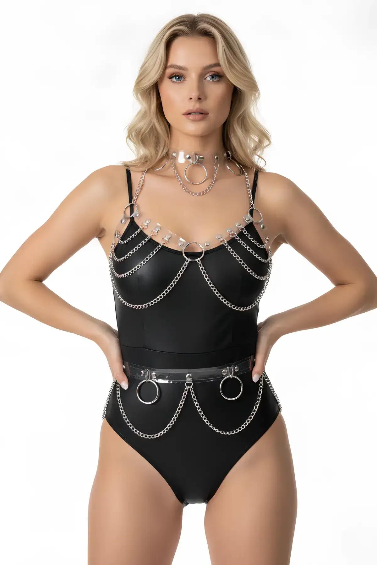 Clear PVC chain body harness set with silver O-rings and draped silver chain loops worn over black bodysuit with matching cho