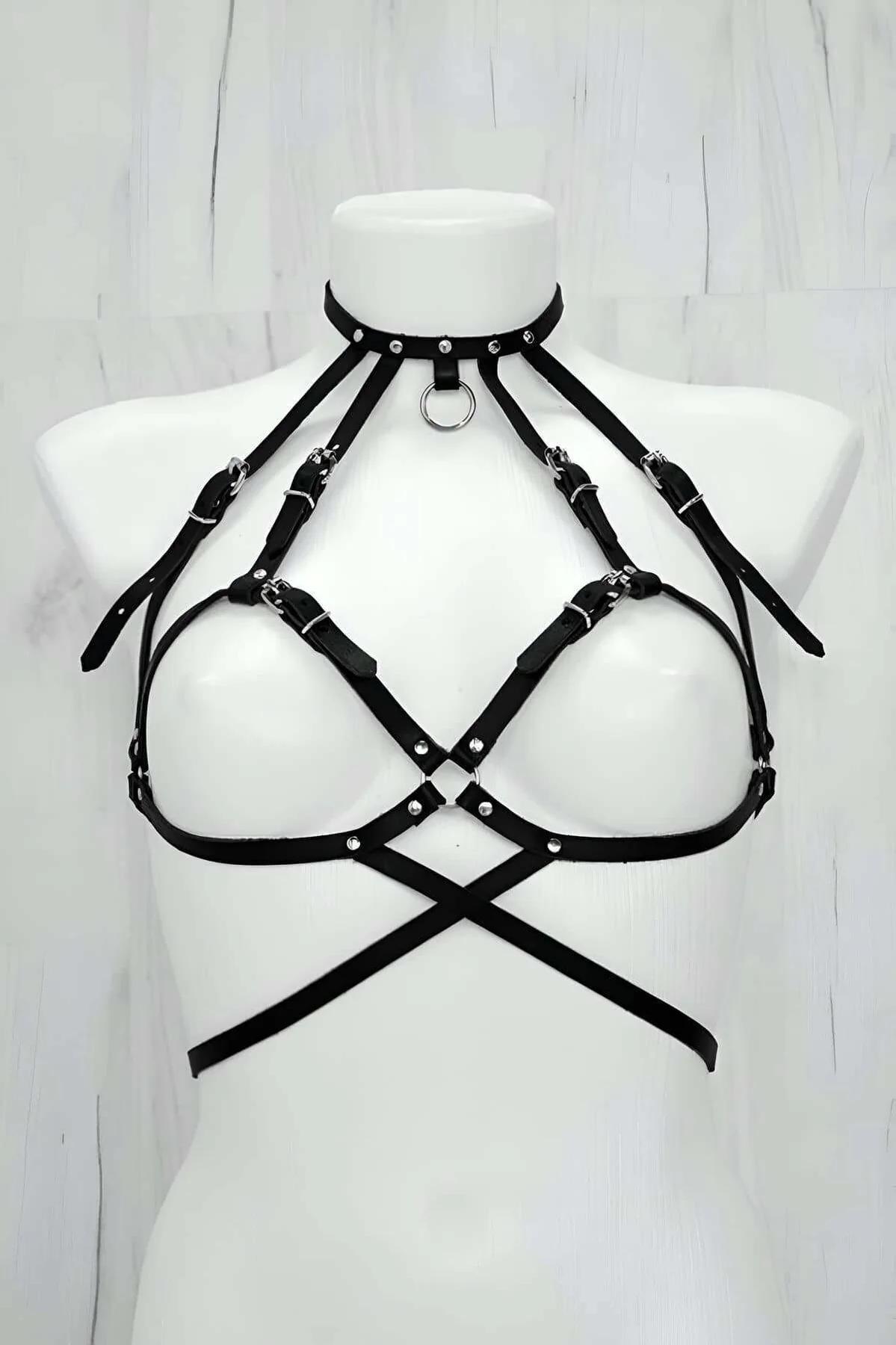 Black faux leather chest harness with O-ring choker, silver buckles, and cross-strap underbust cage on white mannequin