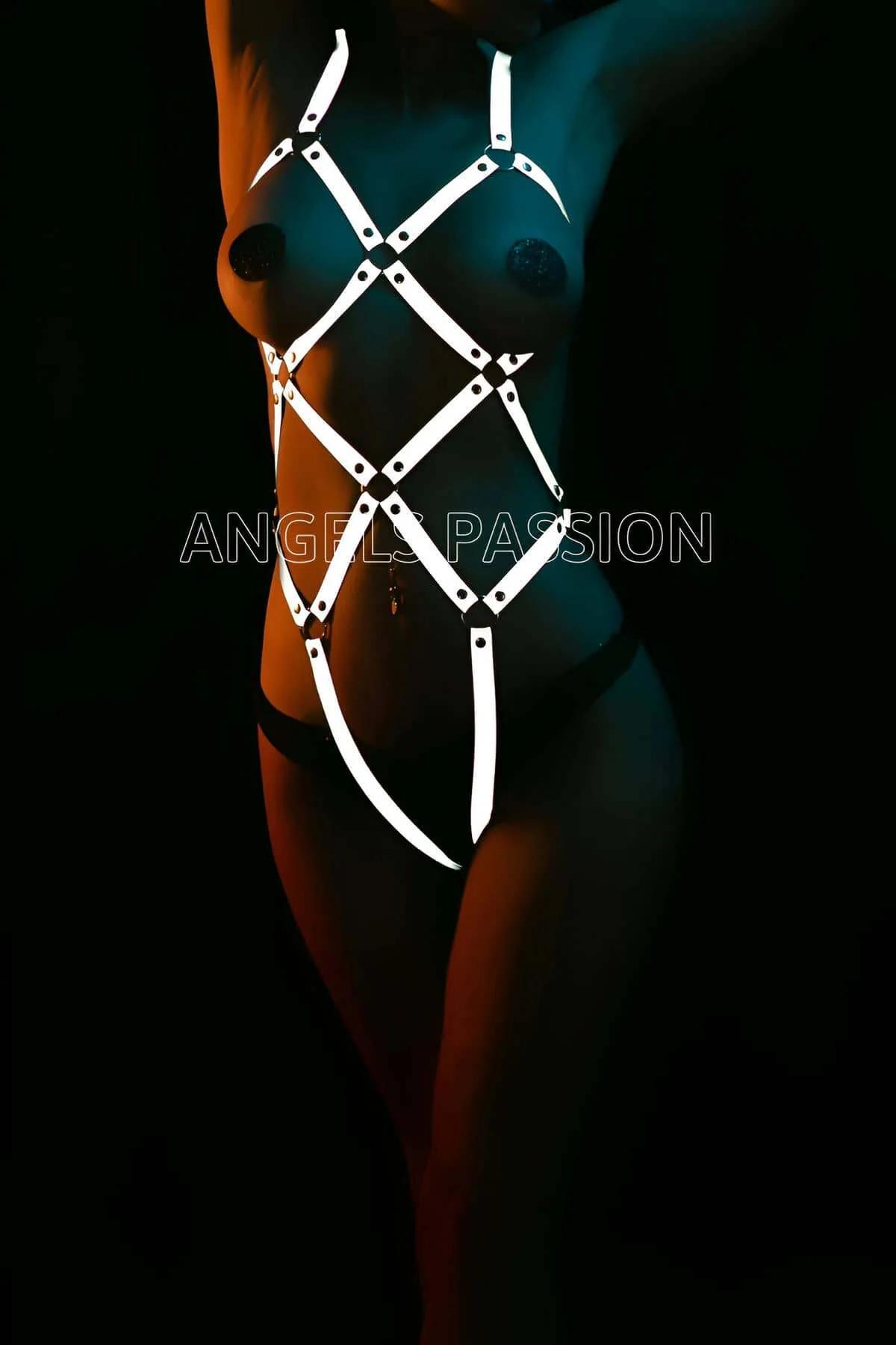 White reflective full body harness with diamond geometric strap pattern and metal junction hardware on dark background