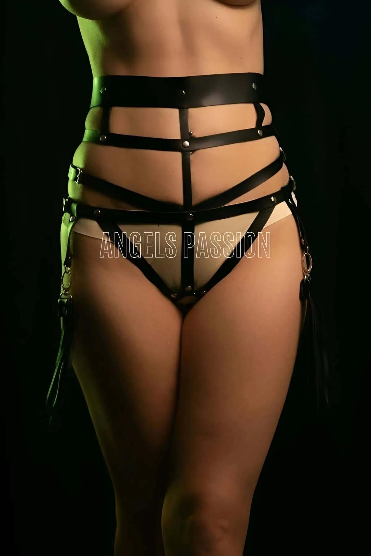 black faux leather high-waist caged harness with adjustable gold O-ring leg straps and silver rivets
