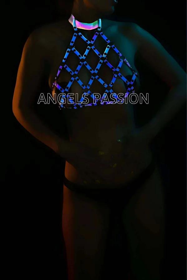 Iridescent reflective chest harness top in blue-purple holographic lattice diamond grid pattern glowing under UV neon light