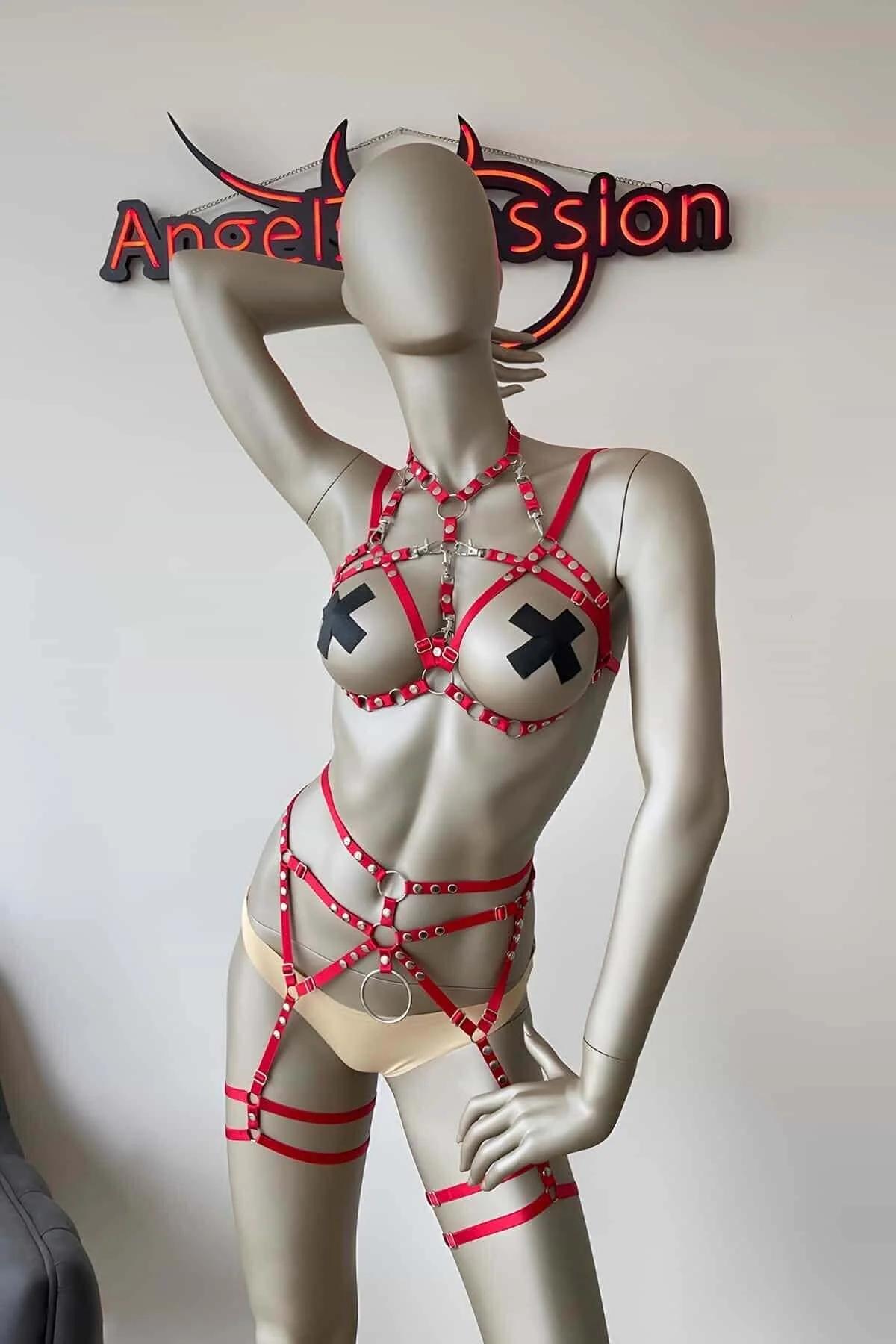 Red faux leather body harness set with silver O-rings and studs, cage waist section, chest harness collar, and thigh garter s