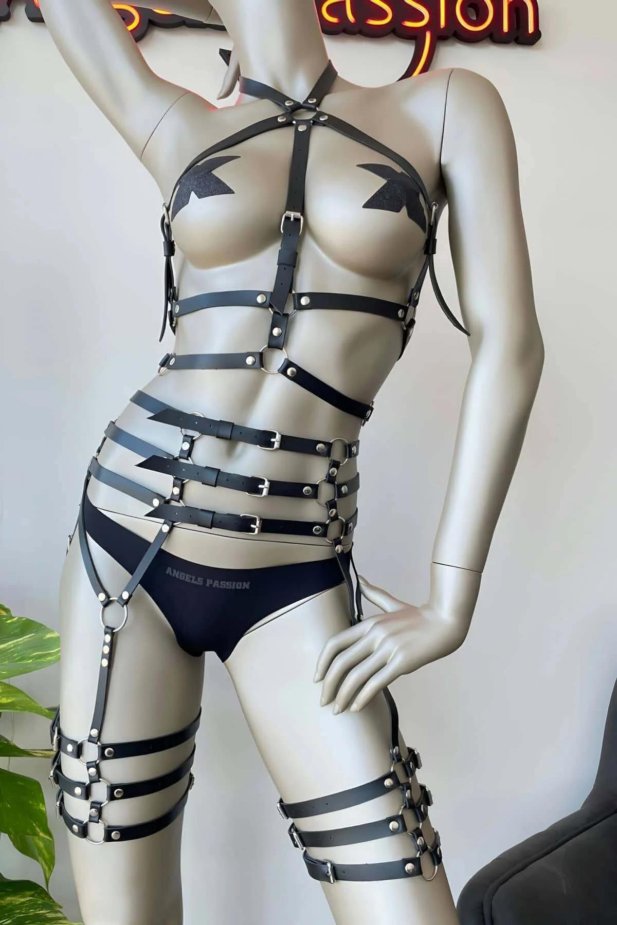 black faux leather full body harness with four-band waist cage and dual thigh garter straps silver O-ring hardware