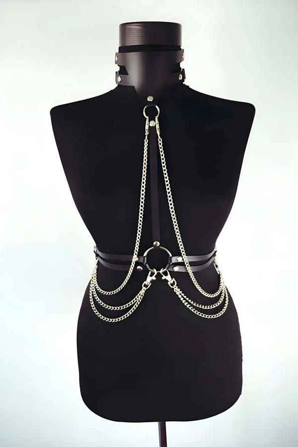 Black faux leather full body harness with three cascading gold-tone curb-link chains connecting choker to waist O-ring band