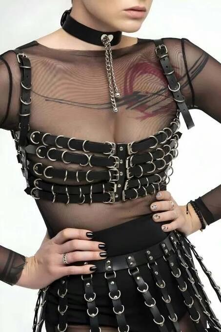 black faux leather full body harness set with O-ring chest cage, layered strip skirt, and silver chain choker