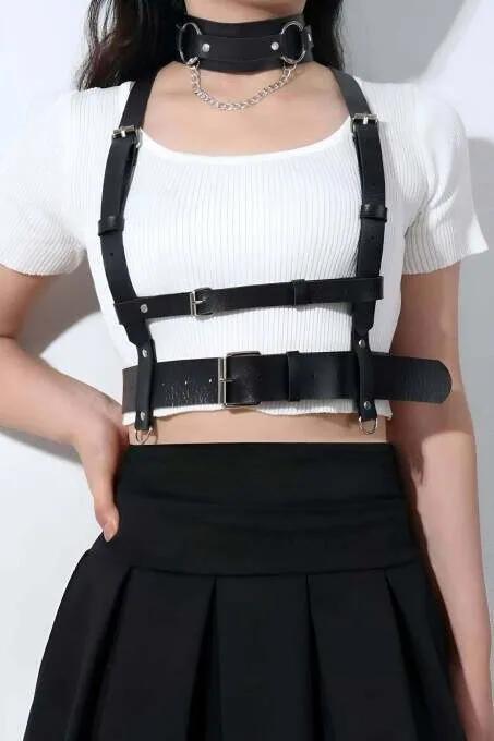 Black faux leather underbust harness with wide waist band, silver pin-buckle shoulder straps, and detachable O-ring chain wor