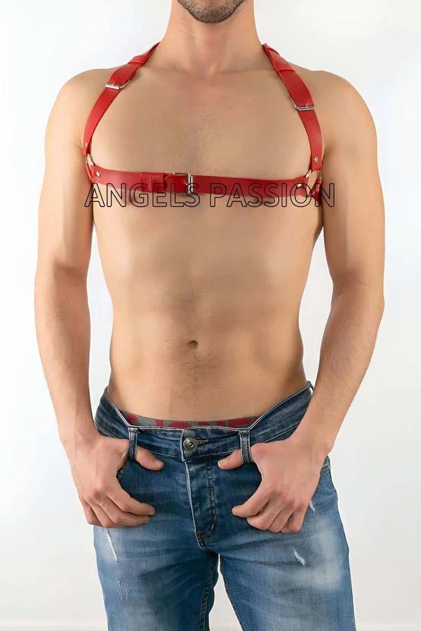 red faux leather chest harness with silver buckles and adjustable shoulder straps worn by male model