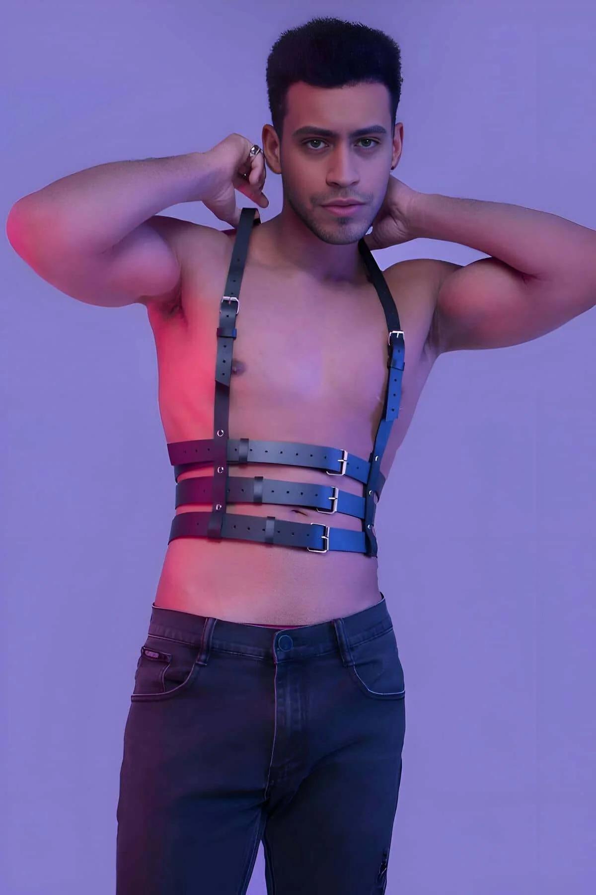 Black faux leather multi-strap body harness with three horizontal waist bands and silver-tone pin buckles worn on male torso