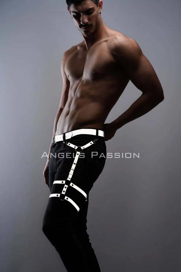 White reflective leg harness with silver D-rings and Y-strap thigh design worn over black trousers