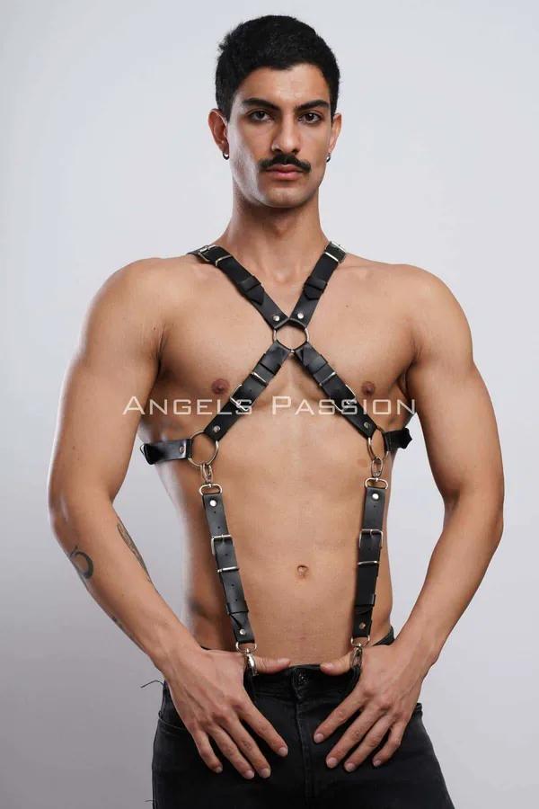black faux leather x-back body harness with gold O-rings and adjustable buckle straps worn on male torso
