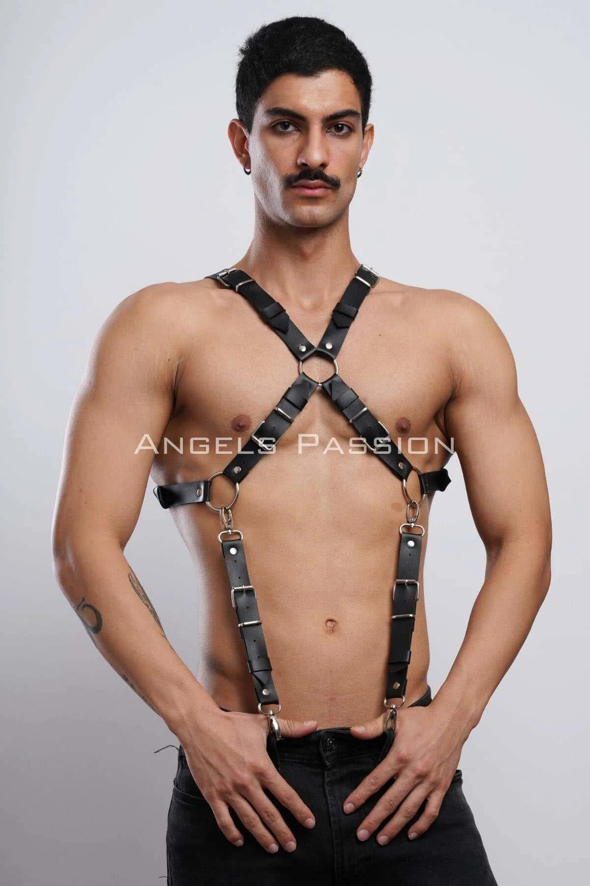 black faux leather x-back body harness with gold O-rings and adjustable buckle straps worn on male torso