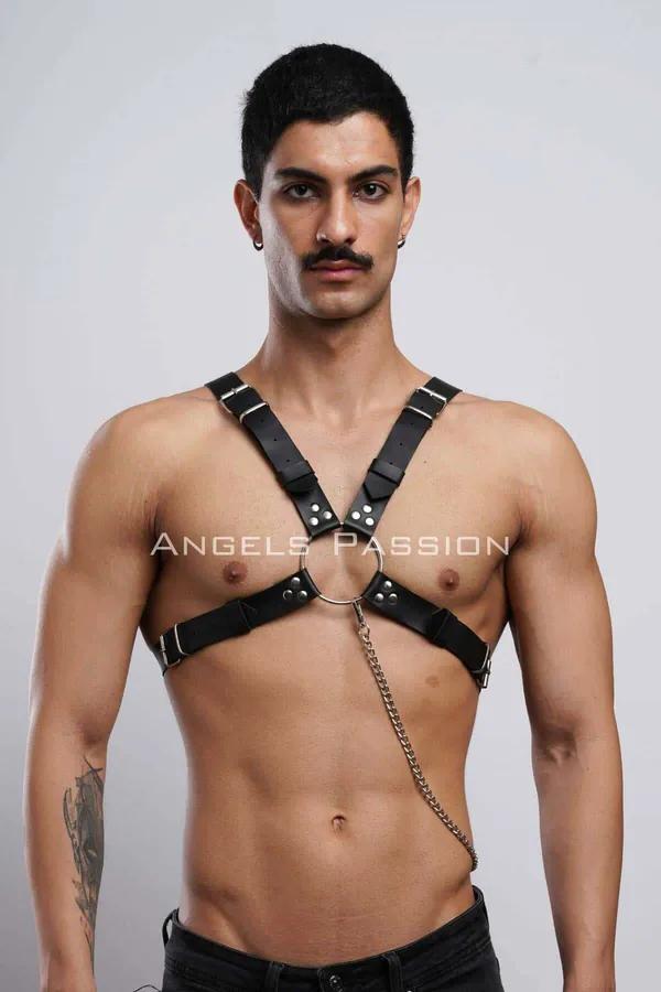 Black faux leather chest harness with silver O-ring center and dangling chain detail on male model