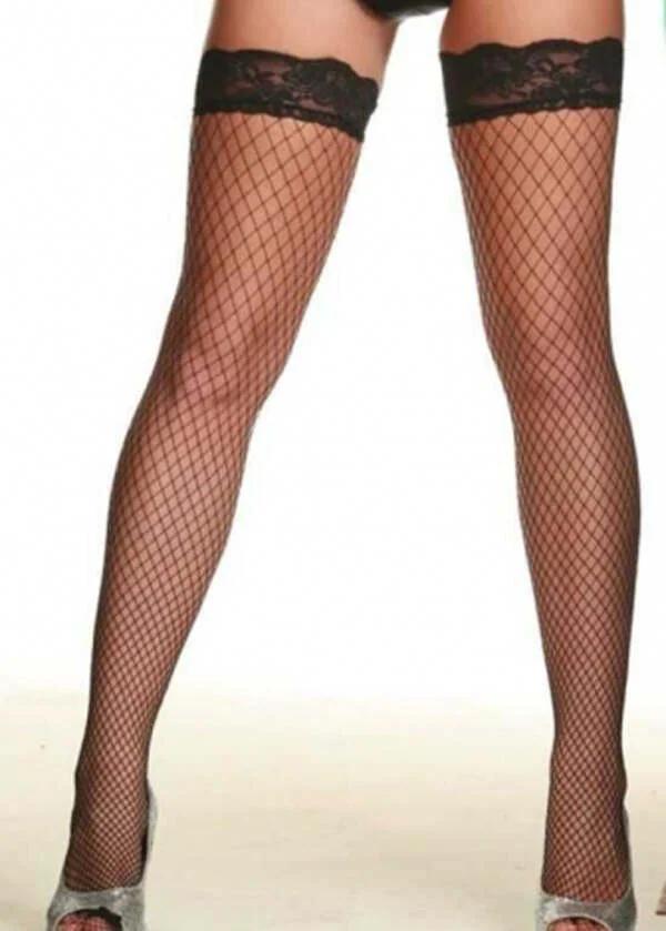 black fishnet thigh high stockings with wide scalloped floral lace top band on legs